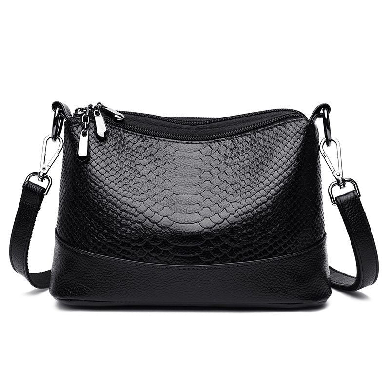 Fashionable shoulder bag with a crocodile print